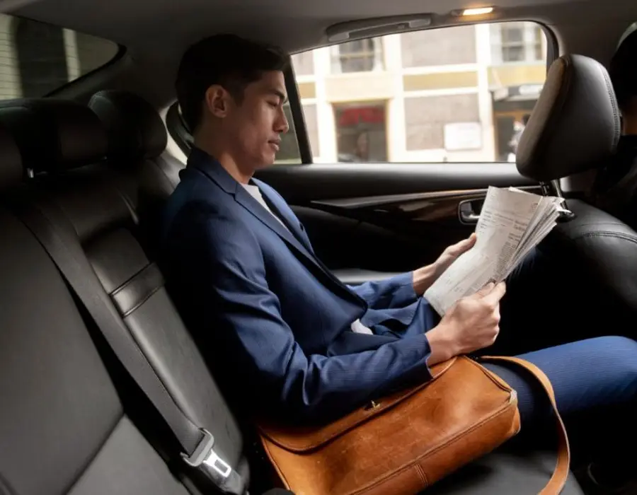 Passenger in the back of a Morden Cars minicab